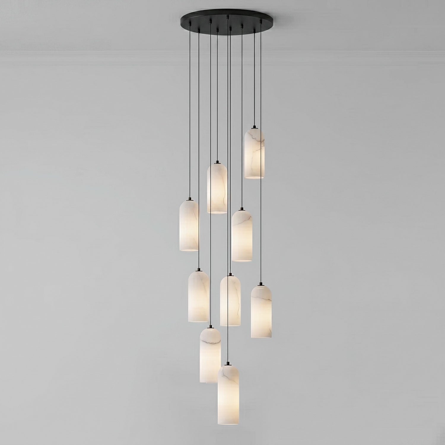 Monty alabaster pendant 9-head cluster lit in a stairwell