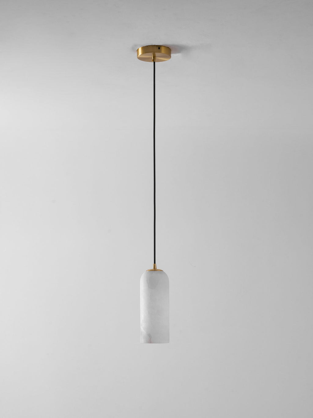 Monty alabaster pendant styled over a kitchen island
