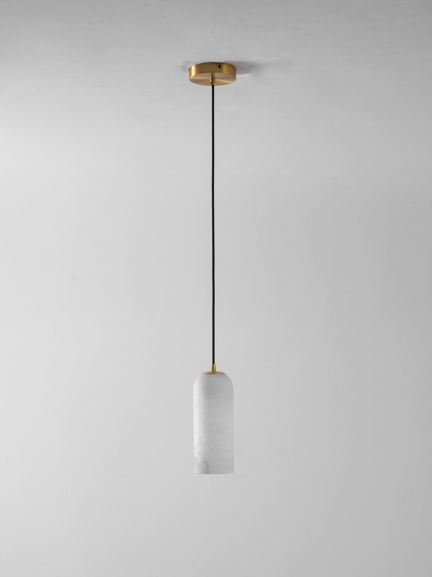 Monty alabaster pendant styled over a kitchen island