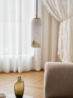 Monty alabaster pendant styled over a dining table