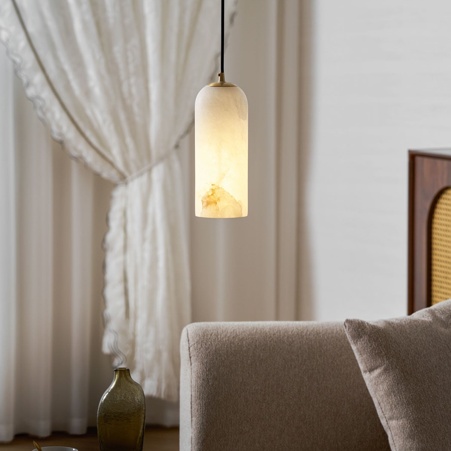Monty alabaster pendant styled over a dining setting