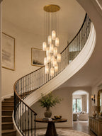 Monty alabaster pendant cluster lit in a foyer