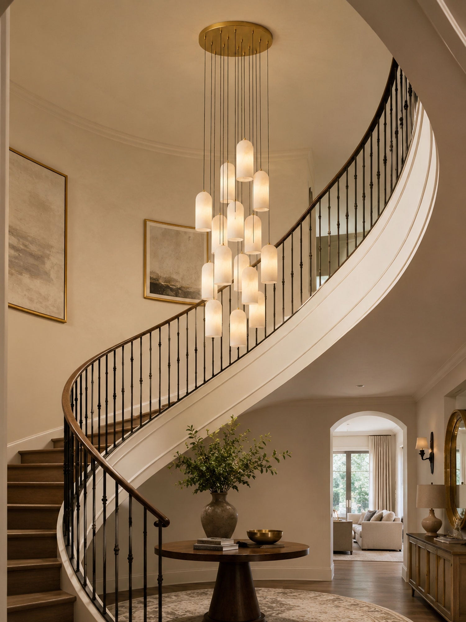 Monty alabaster pendant cluster lit in a foyer