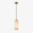Hecate pendant shown in full with its brass ceiling plate and long black cord on a grey background.
