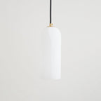 Unlit Zashayra pendant on a plain white background, showing the rounded top and straight sides of the shade.
