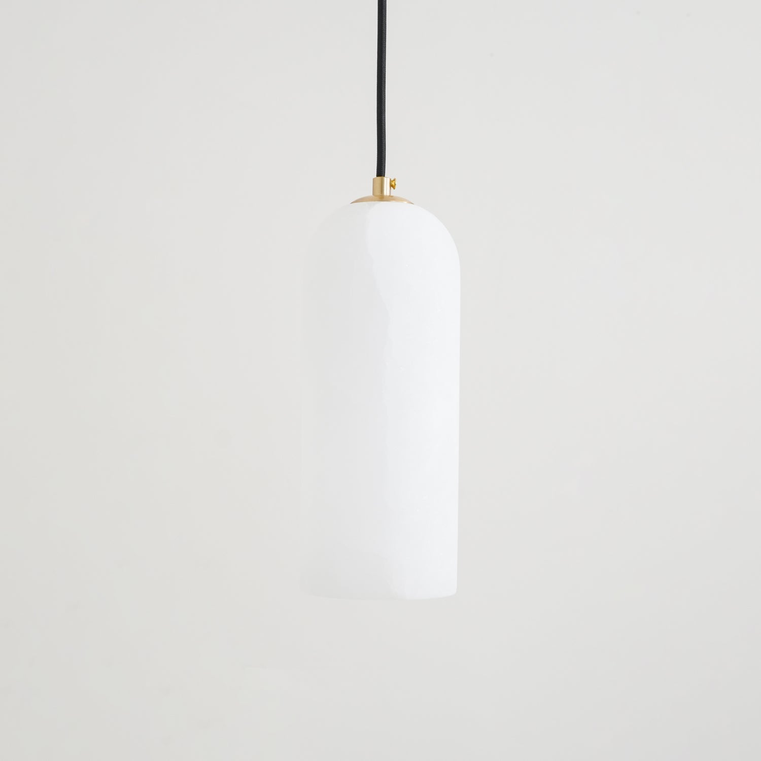Unlit Zashayra pendant on a plain white background, showing the rounded top and straight sides of the shade.