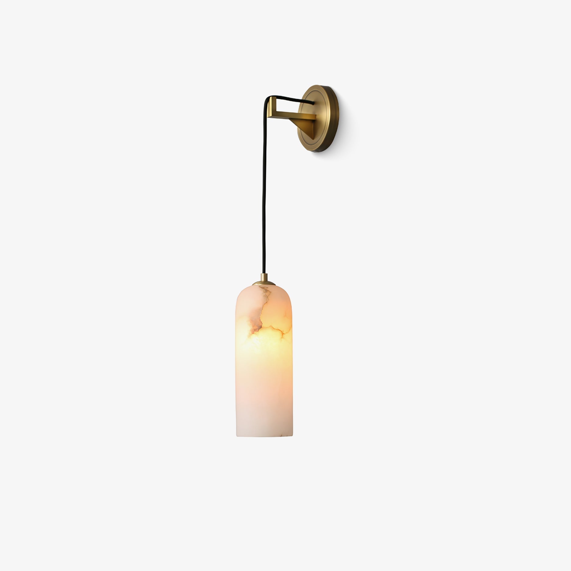 Vaelara wall sconce shown from the opposite side, brass plate right and the lit shade on a long cord