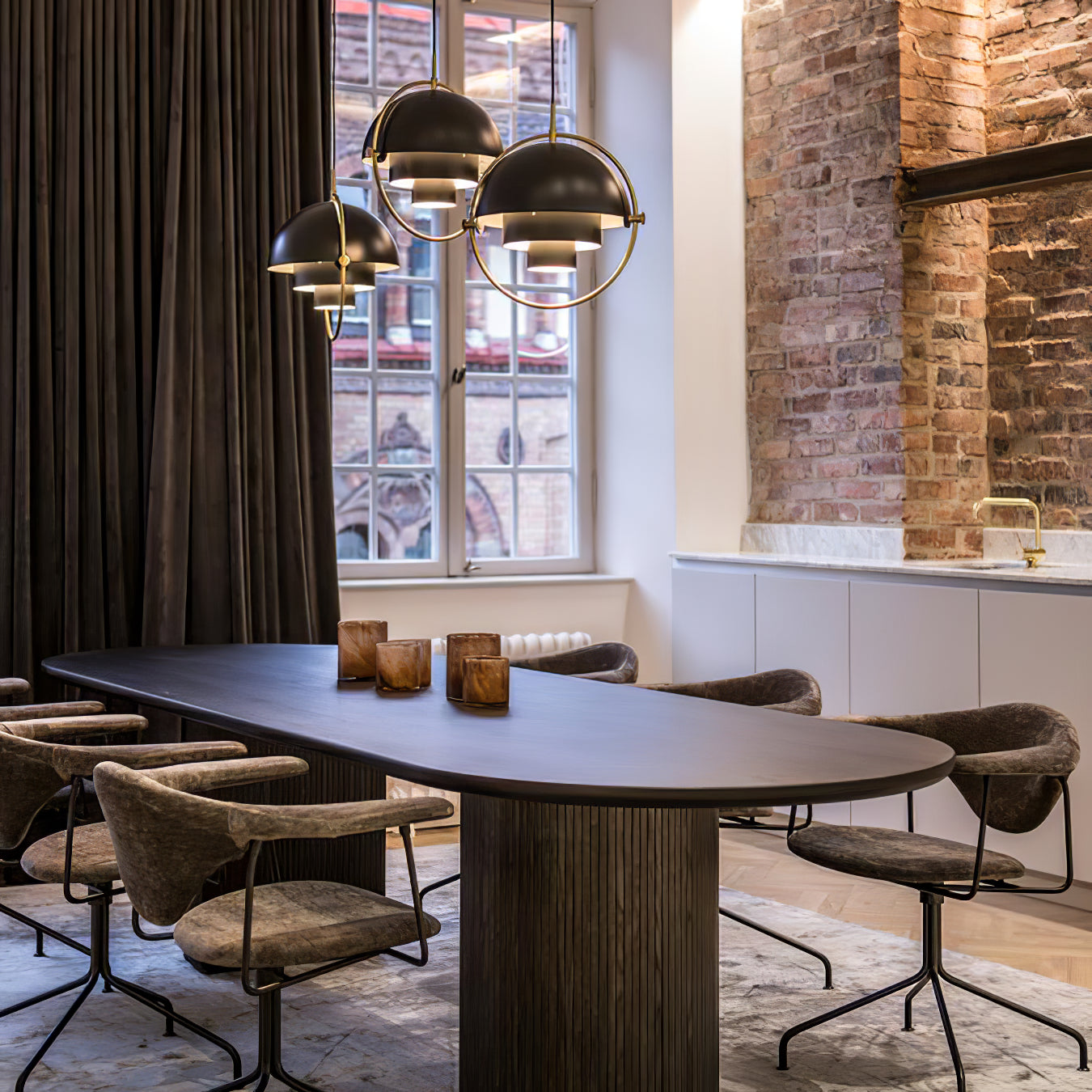 Multi-Lite pendant light in a chrome finish reflecting the surrounding room