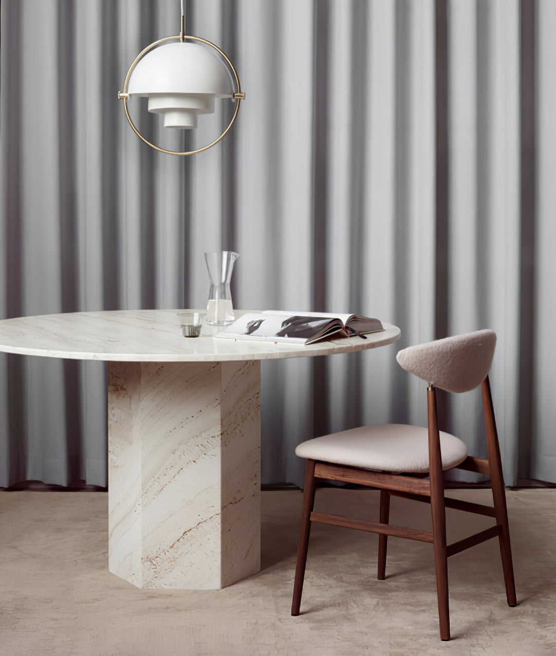 Multi-Lite pendant light over a dining table casting a focused downward pool of light