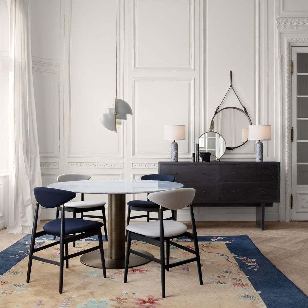 Multi-Lite pendant light with two movable hemisphere halves hanging in a styled interior