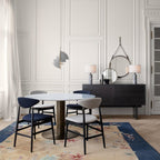 Multi-Lite pendant light with two movable hemisphere halves hanging in a styled interior