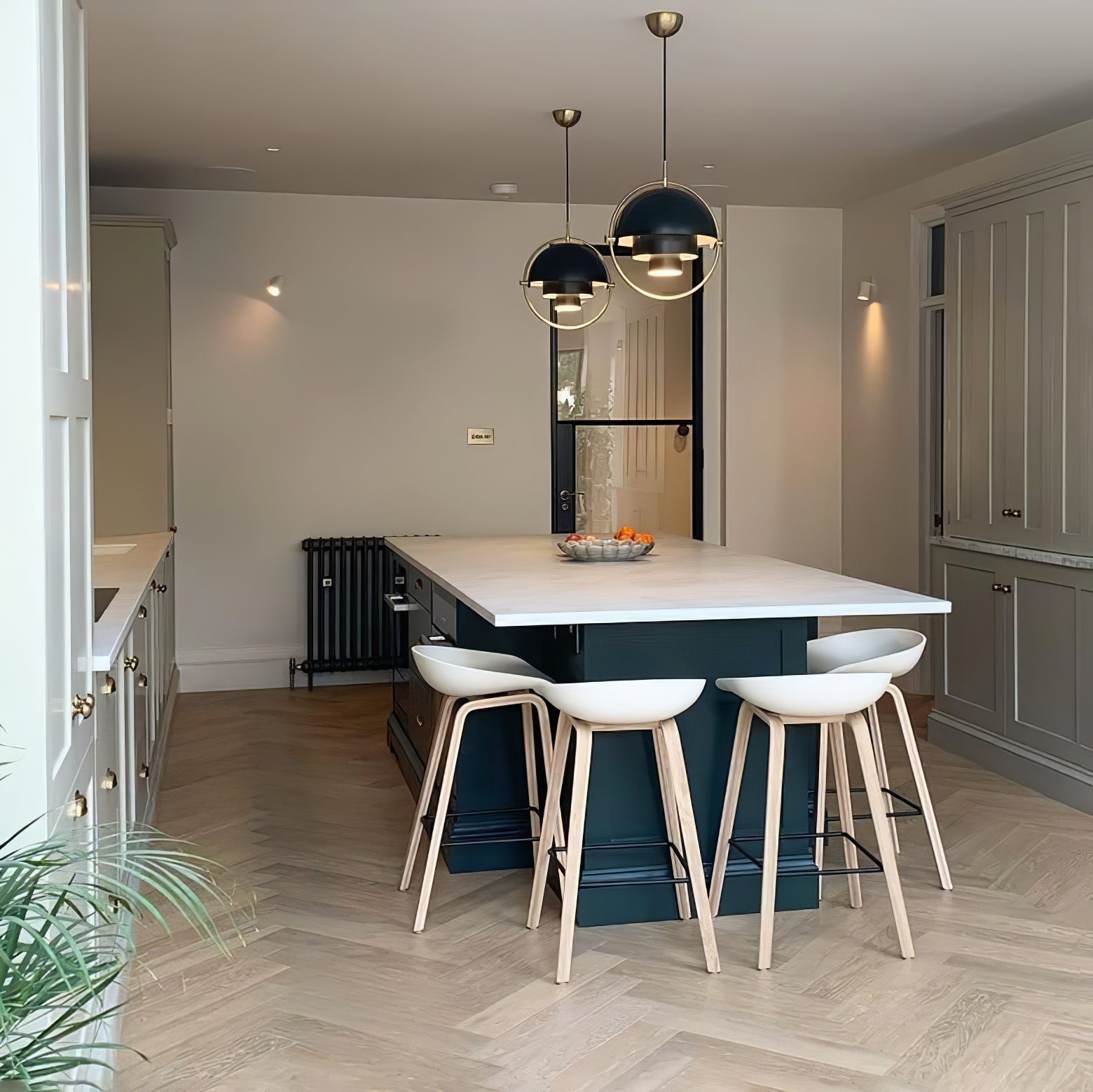 Multi-Lite pendant light in a copper finish suspended above a seating area