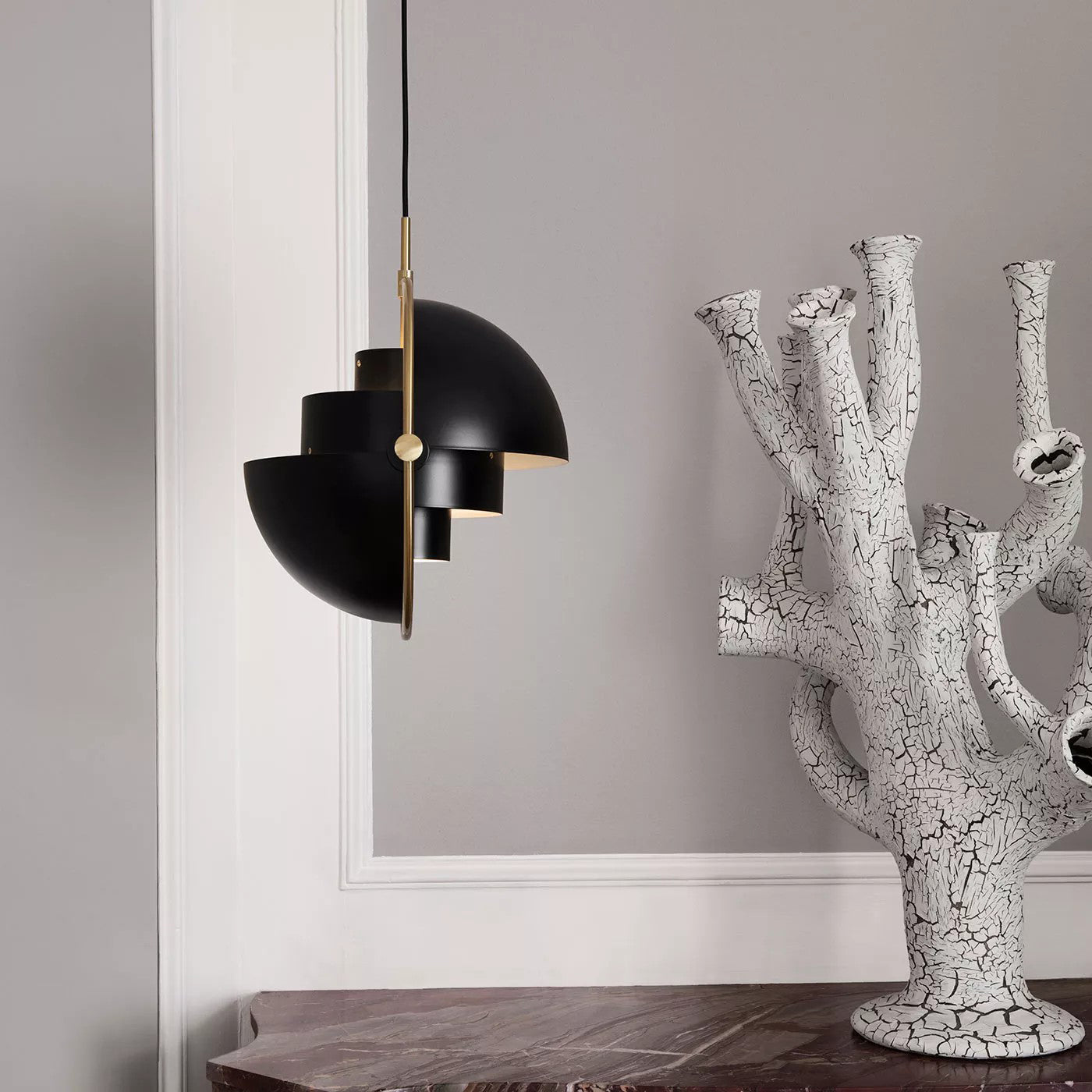Multi-Lite pendant light shown with the shade halves turned for a soft ceiling glow
