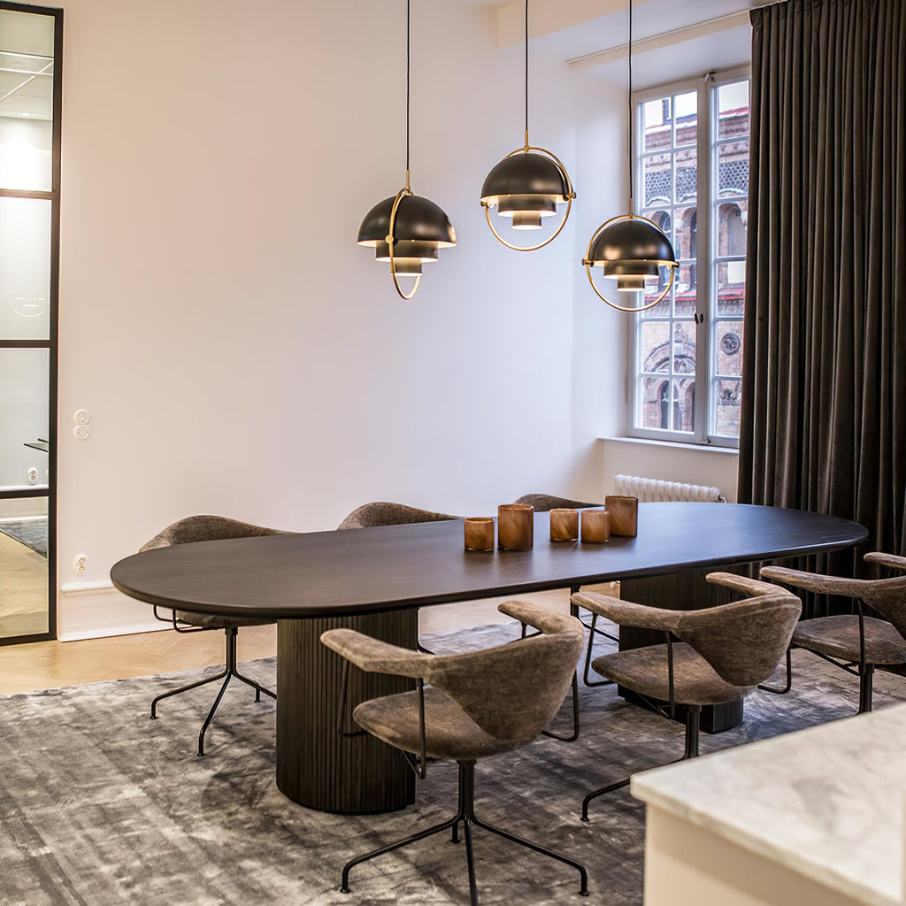 Multi-Lite pendant light in a copper finish suspended above a seating area
