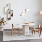 Multi-Lite pendant light over a dining table casting a focused downward pool of light