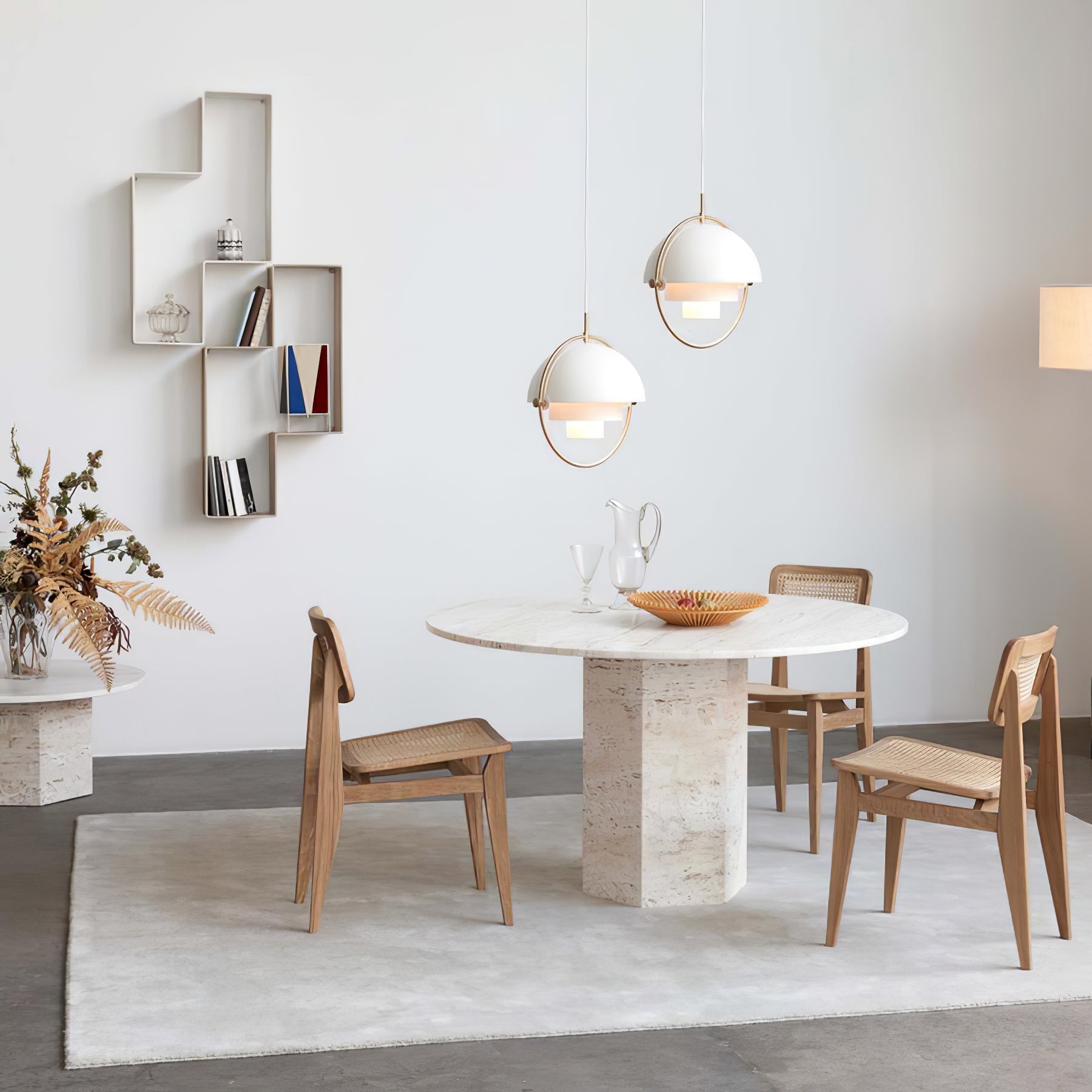 Multi-Lite pendant light over a dining table casting a focused downward pool of light