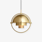 Multi-Lite pendant light with two movable hemisphere halves hanging in a styled interior