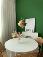 Multi-Lite pendant light arranged for sculptural indirect light in a living space