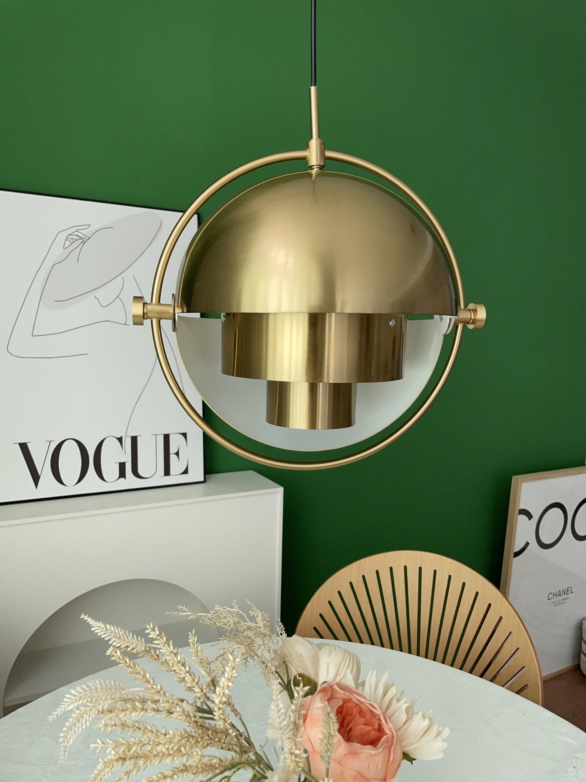 Multi-Lite pendant light in a copper finish suspended above a seating area
