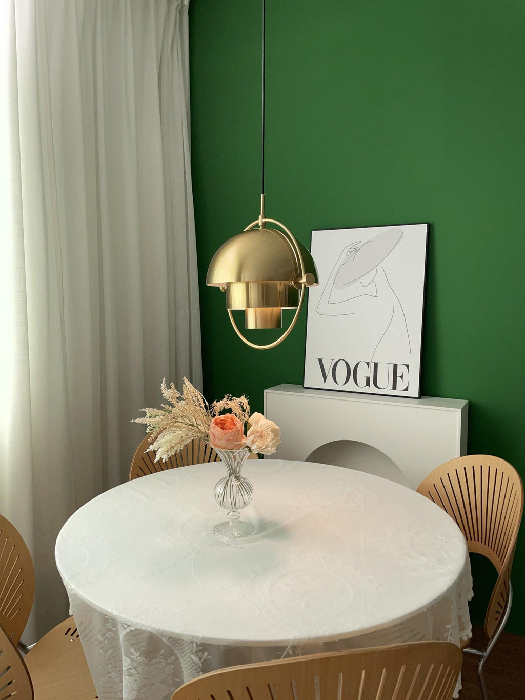 Multi-Lite pendant light in a copper finish suspended above a seating area