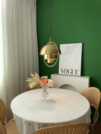 Multi-Lite pendant light in a copper finish suspended above a seating area