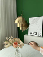 Multi-Lite pendant light over a dining table casting a focused downward pool of light