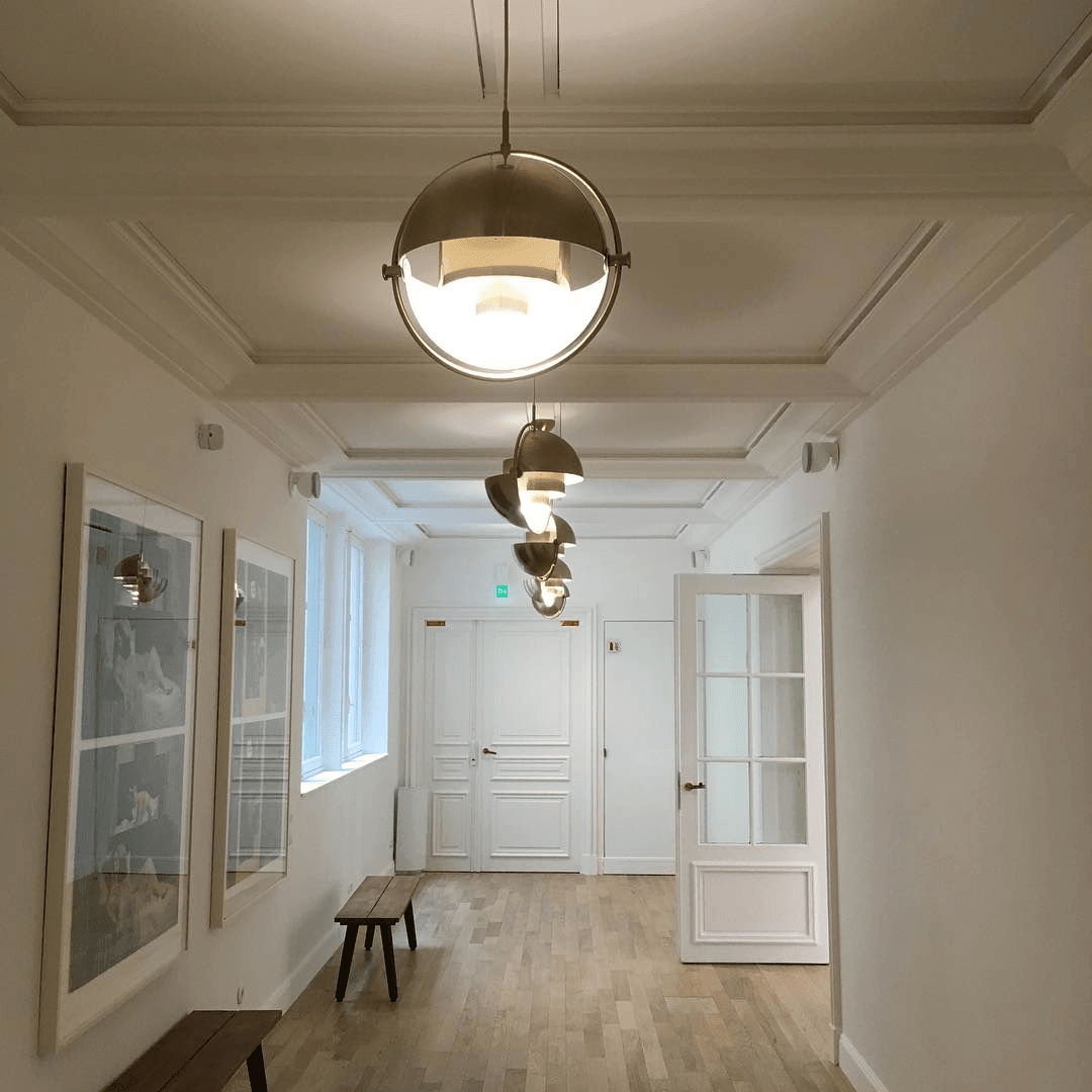 Multi-Lite pendant light shown from below highlighting the adjustable shade halves