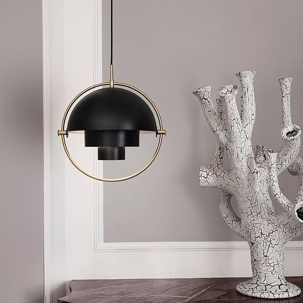 Multi-Lite pendant light in a copper finish suspended above a seating area
