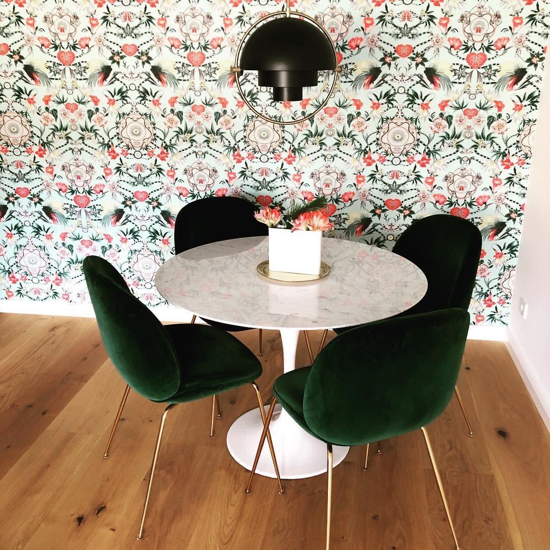 Multi-Lite pendant light with two movable hemisphere halves hanging in a styled interior