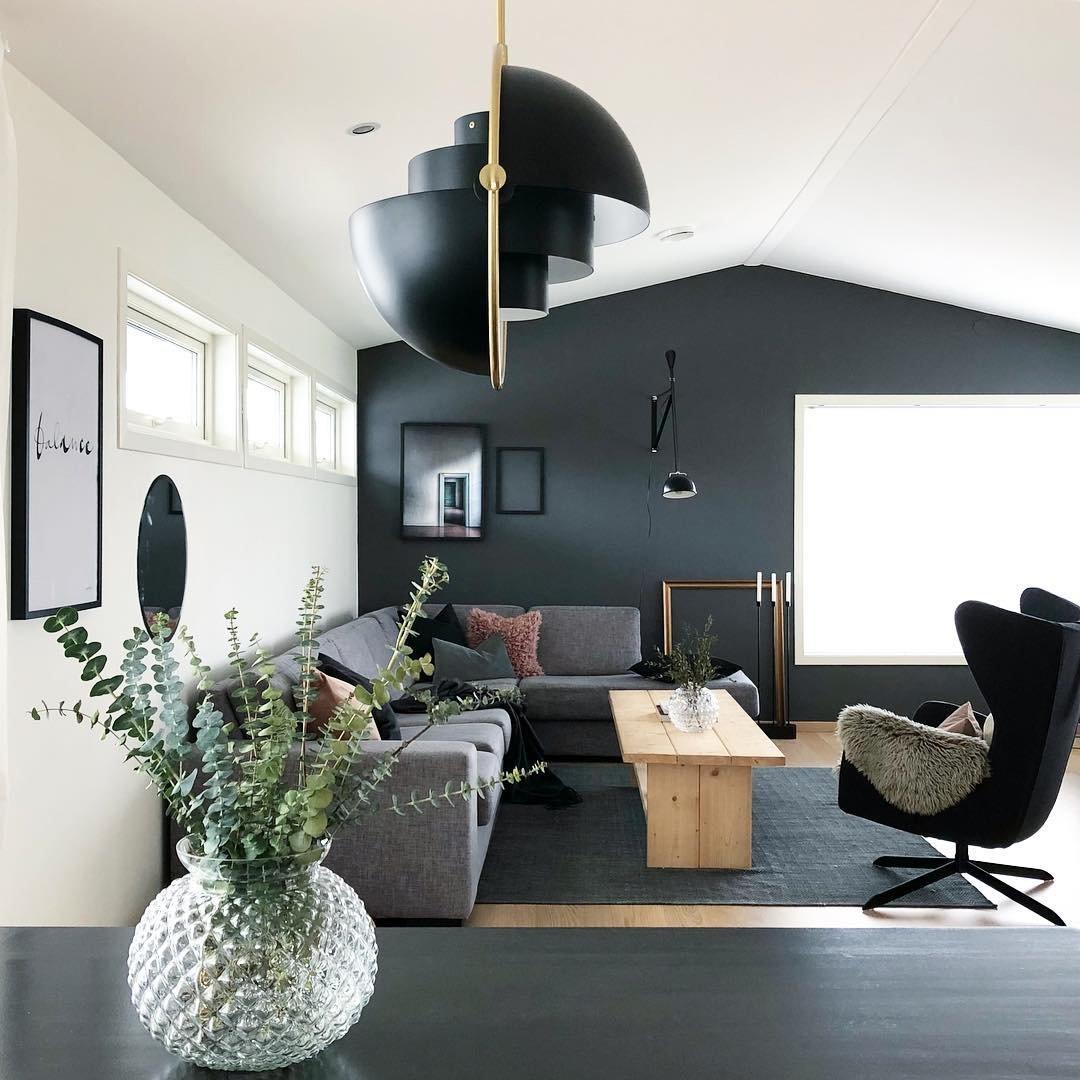 Multi-Lite pendant light with two movable hemisphere halves hanging in a styled interior