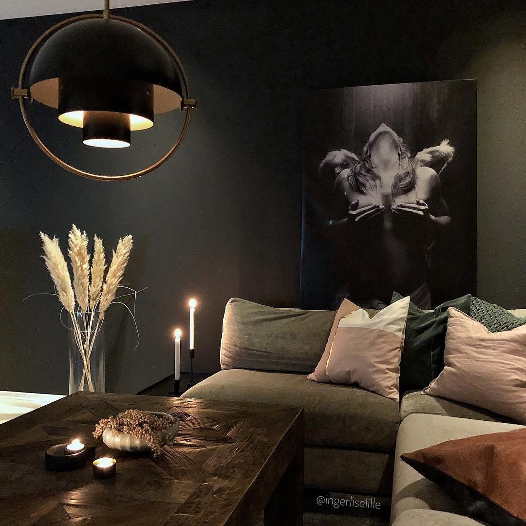 Multi-Lite pendant light in a copper finish suspended above a seating area