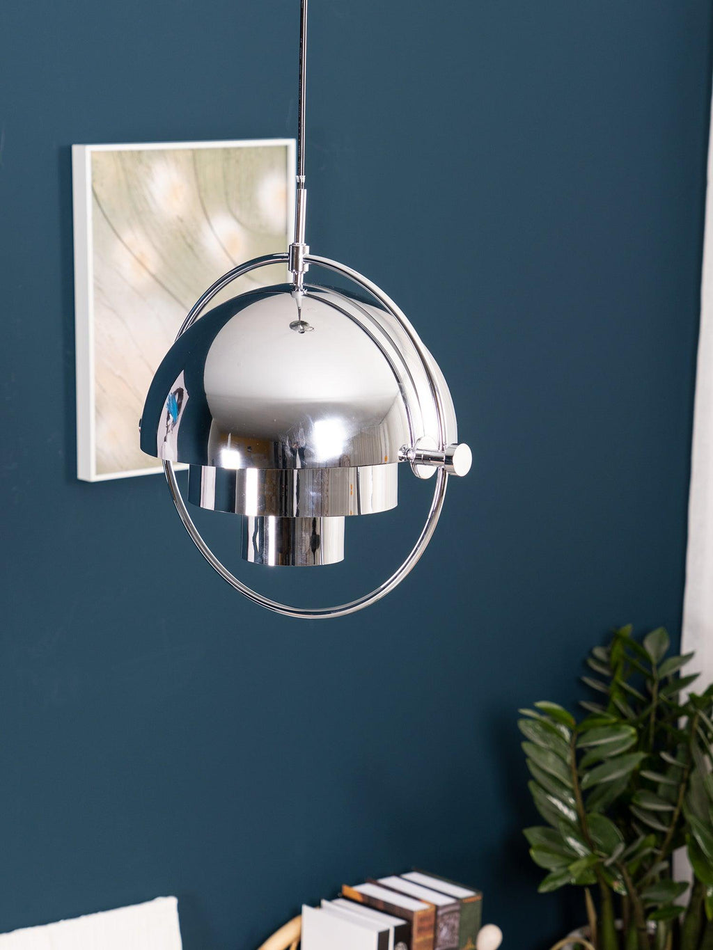 Multi-Lite pendant light in a copper finish suspended above a seating area
