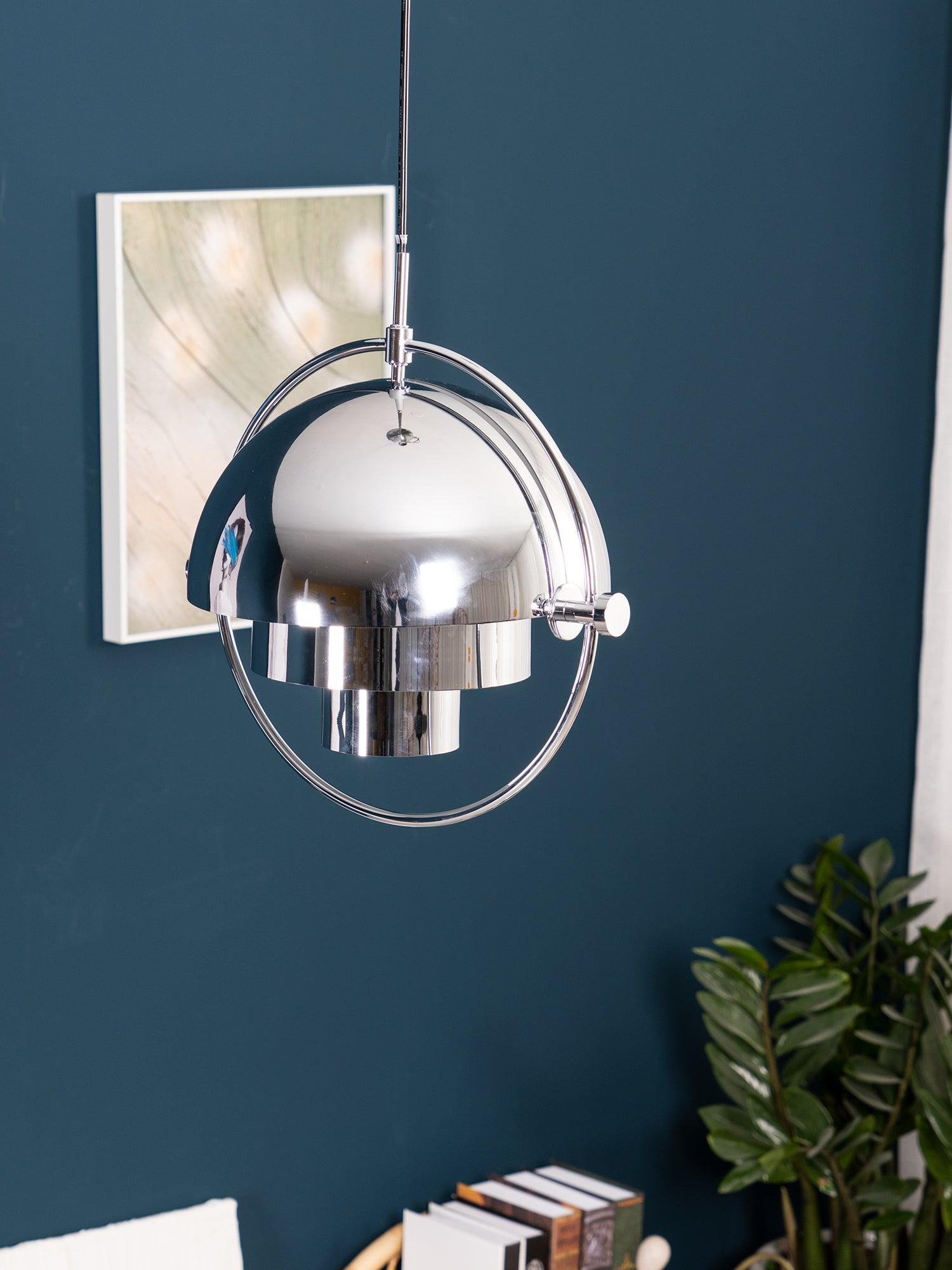 Multi-Lite pendant light in a copper finish suspended above a seating area