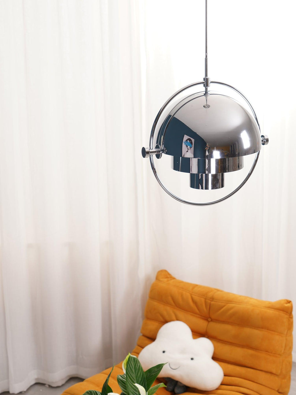 Multi-Lite pendant light in a chrome finish reflecting the surrounding room