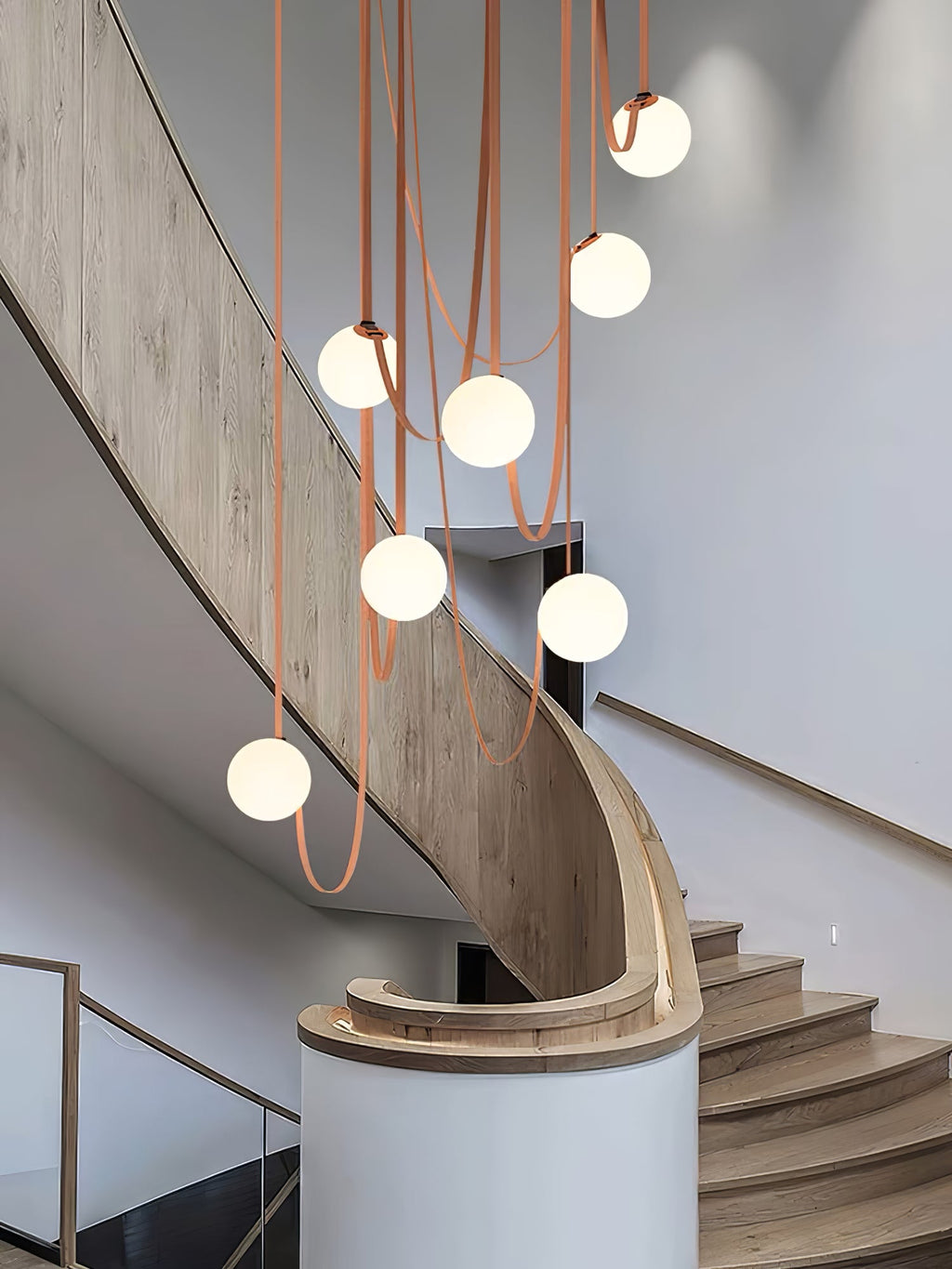 Multiple Belt Art Pendant Light lit above a living space