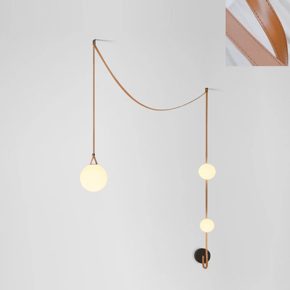 Leather belt and glass globe single-head detail of the pendant light