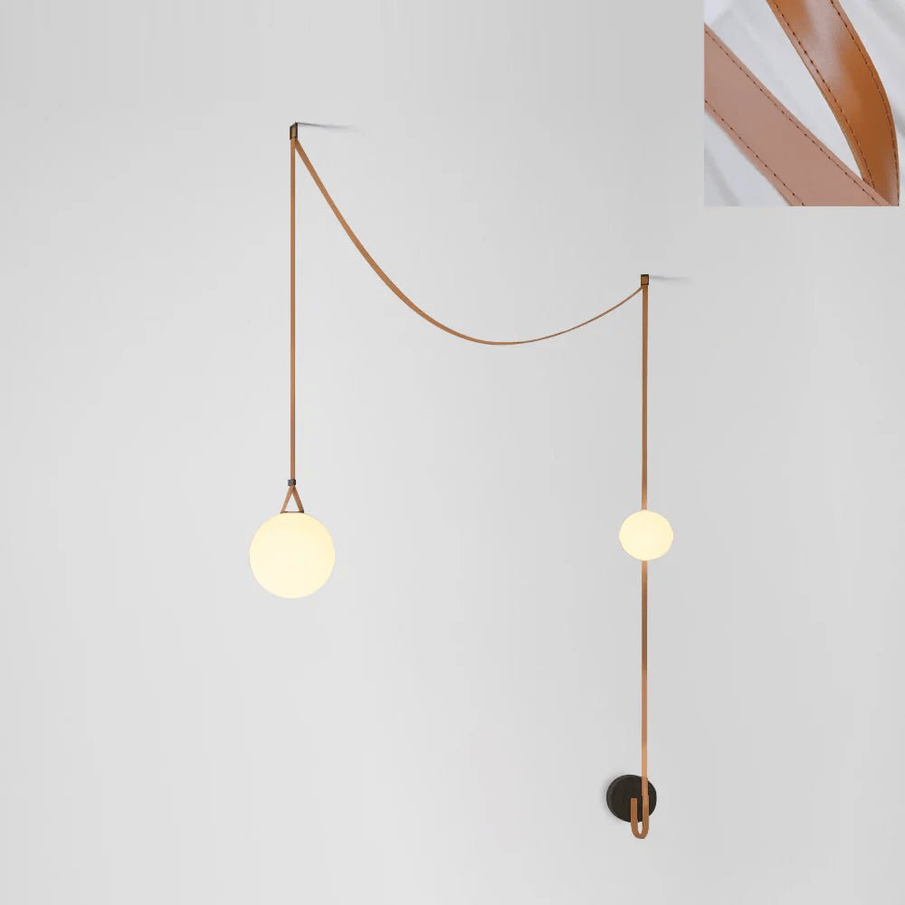 Pendant light glass globe and buckle hardware detail