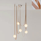Single white glass globe and leather belt detail of the pendant light
