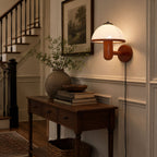 Mushroom wall lamp with plug-in cord shown along the wall