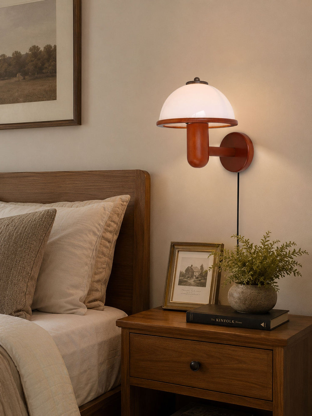 Mushroom wood wall lamp styled above a console table in a living space