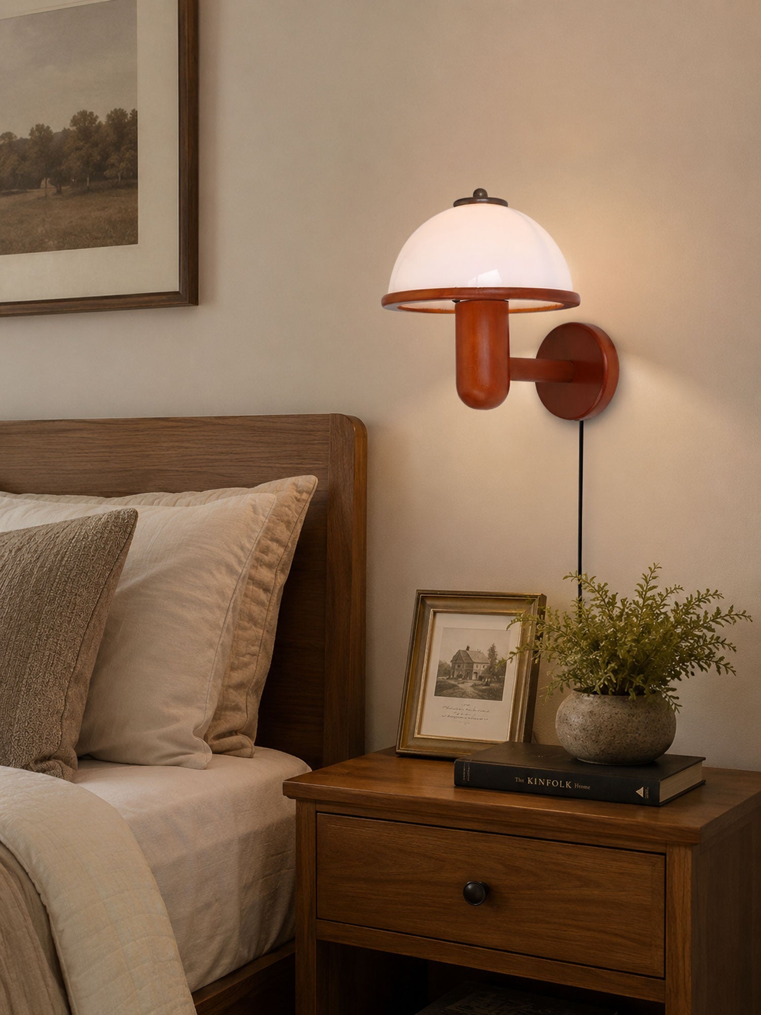 Mushroom wood wall lamp styled above a console table in a living space