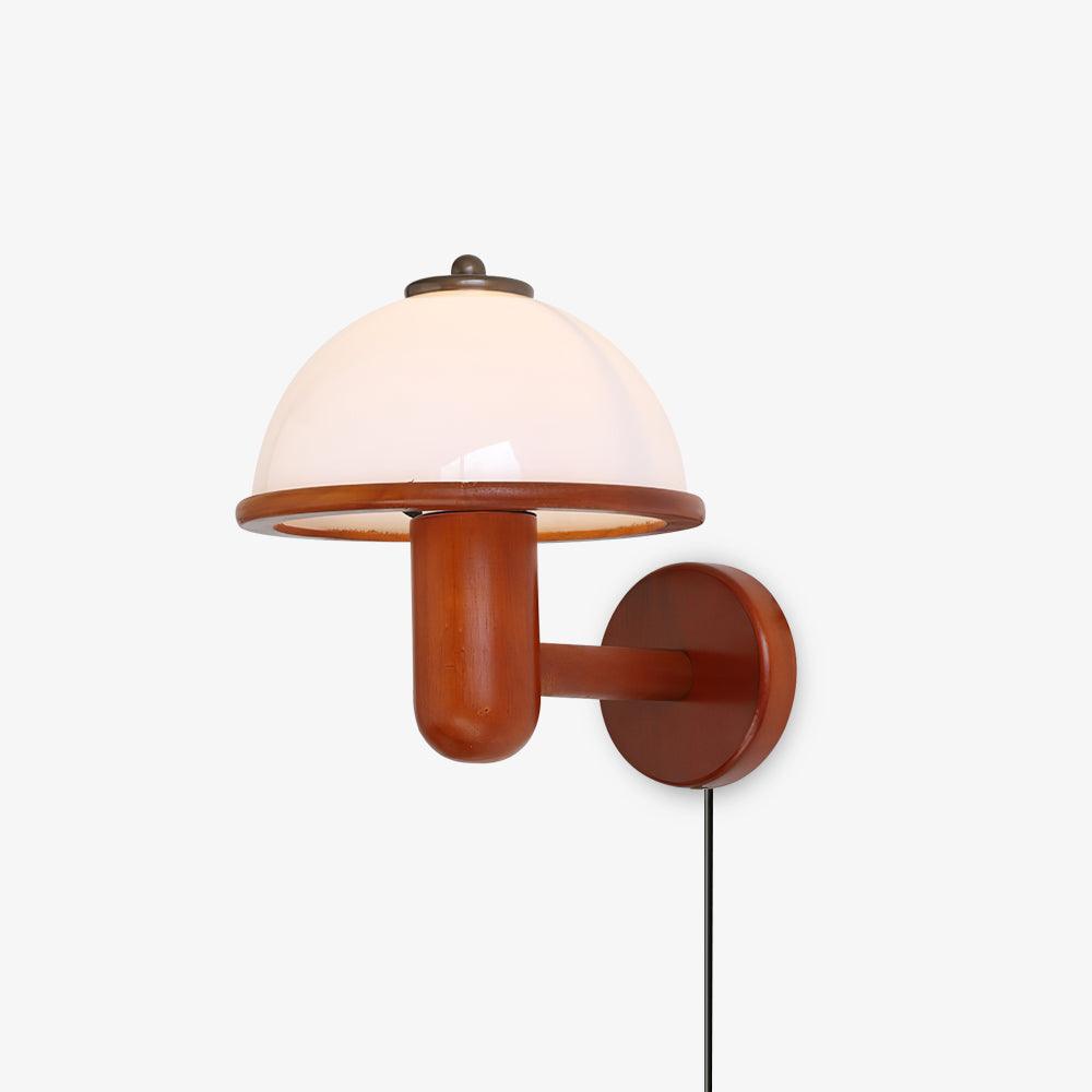 Mushroom wall lamp in dark oak wood with a white diffuser shade, lit on a wall