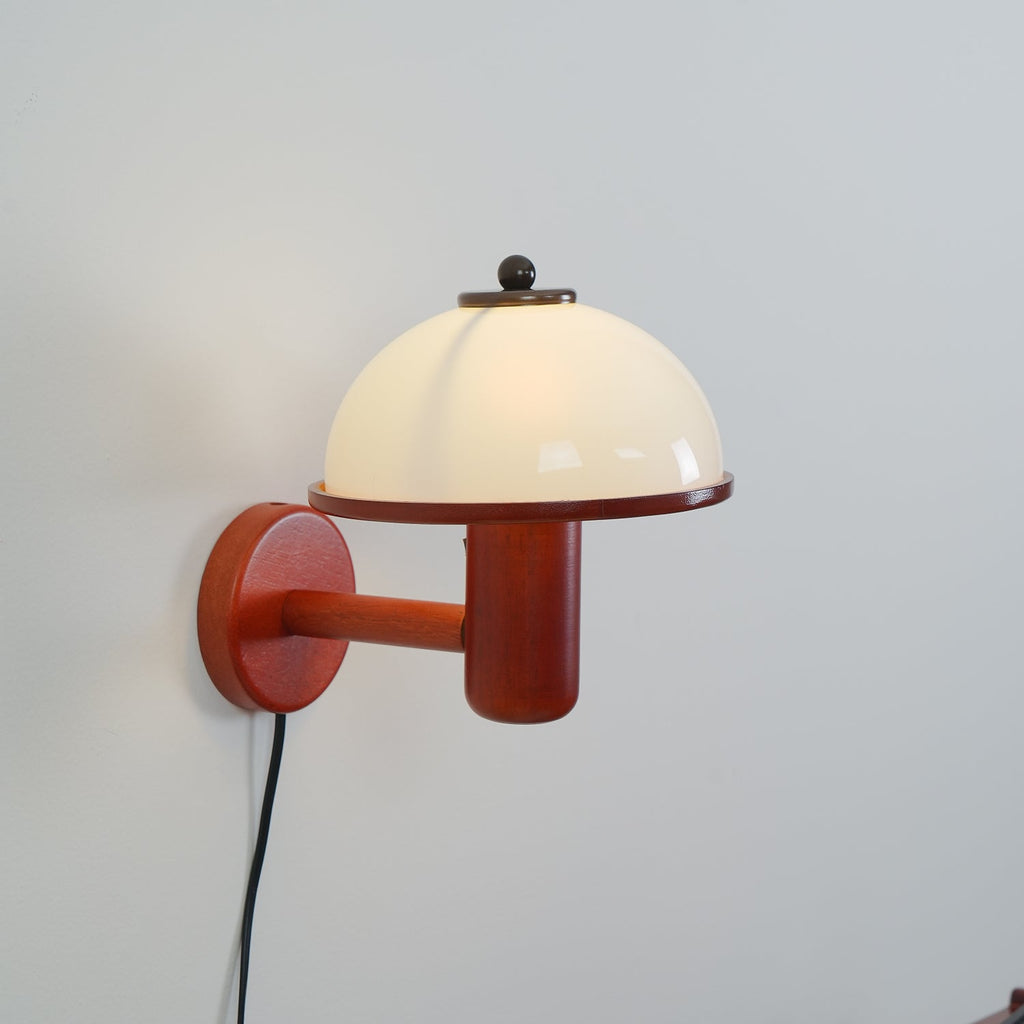 Mushroom wall lamp shown in a styled reading nook
