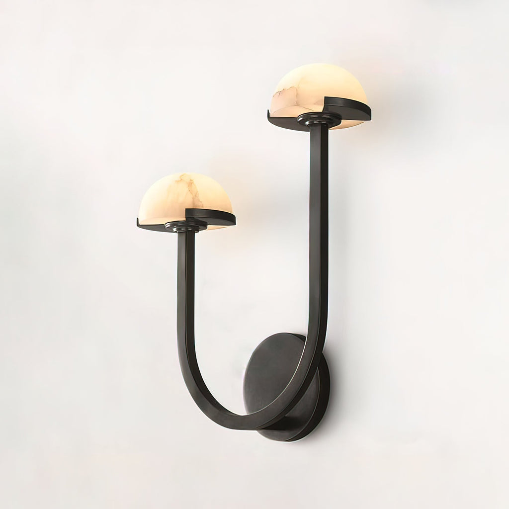 Vitalira Double Alabaster Wall Light in black at an angle on off-white, arms sweeping from the plate.