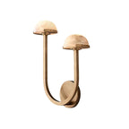 Brass Vitalira Double Alabaster Wall Light on white, the two arms rising to different heights.