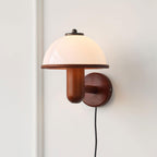 Mushroom wall lamp with inline switch cord on a light wall