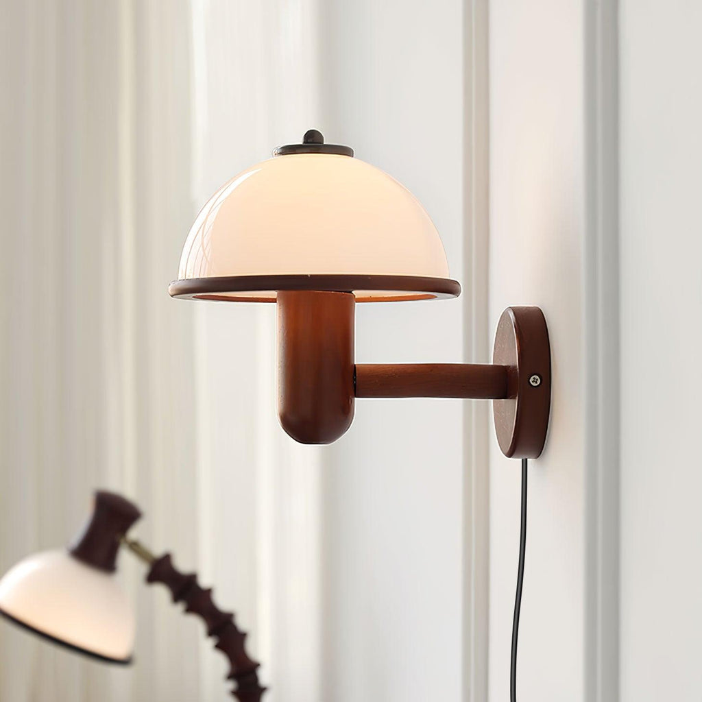 Dark oak mushroom wall lamp glowing in a styled living area