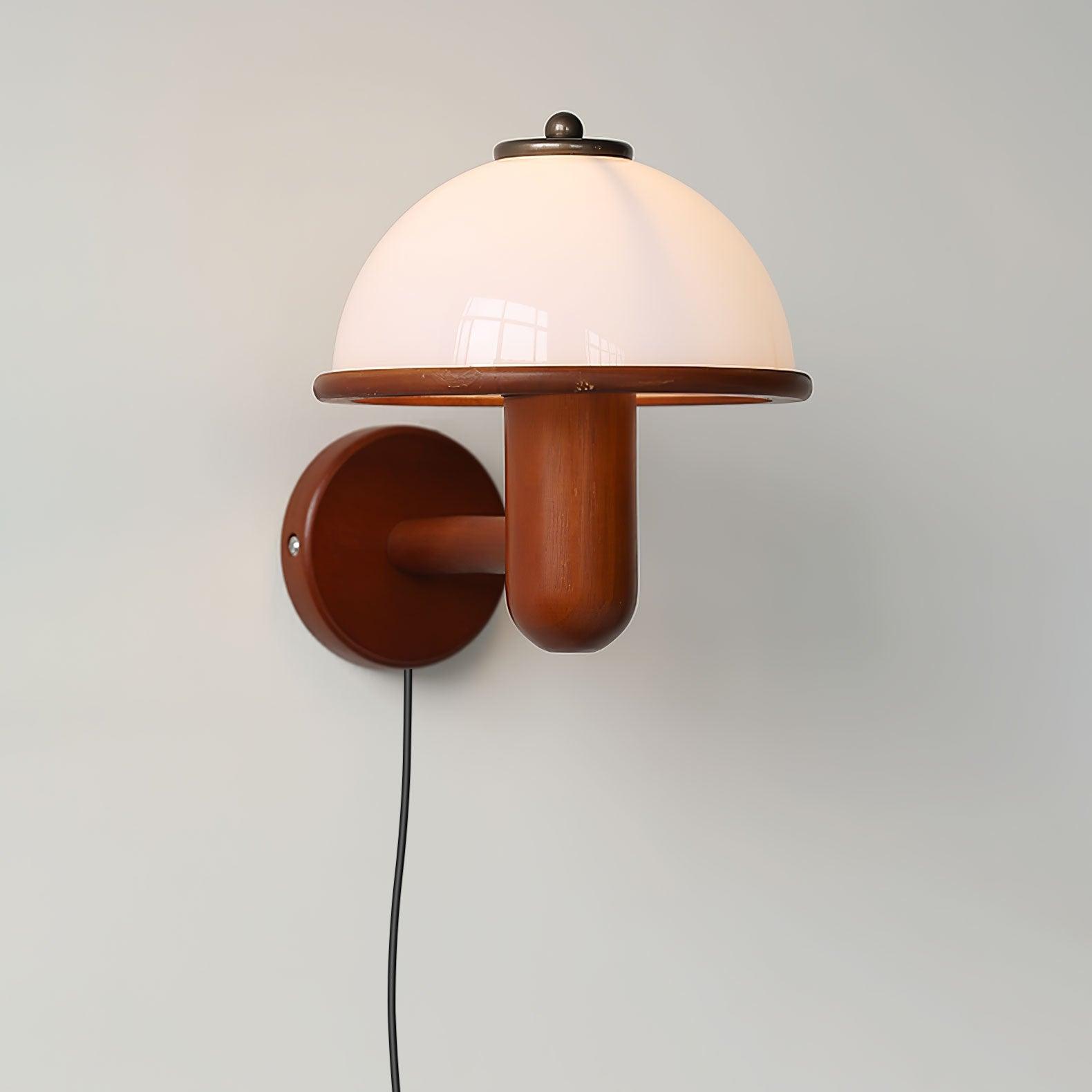 Mushroom wall lamp shown from below highlighting the diffuser glow