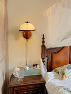 Oak mushroom wall lamp detail showing the natural grain pattern