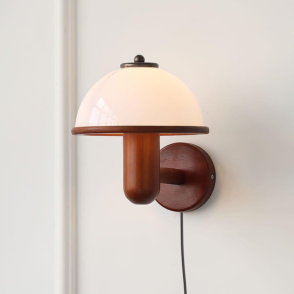 Close-up of the oak body and white shade of the mushroom wall lamp